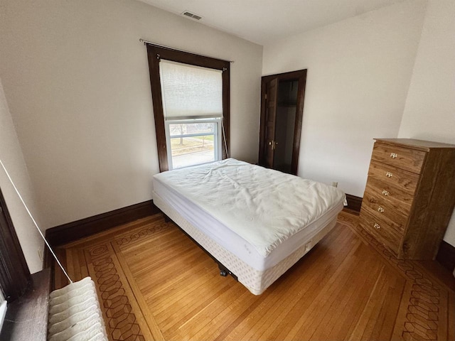 195 E Park Ave, Berlin, WI 54923 - bedroom featuring wood finished floors and baseboards