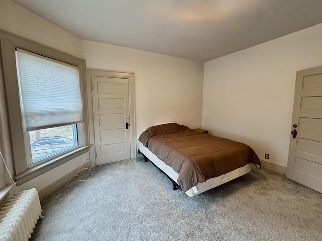 195 E Park Ave, Berlin, WI 54923 - carpeted bedroom with radiator heating unit