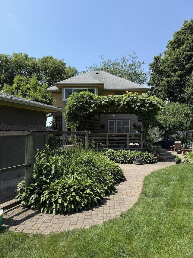 2505 Robinsdale Ave, La Crosse, WI 54601 - rear view of property with a shingled roof and a patio area