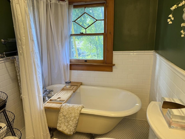 2505 Robinsdale Ave, La Crosse, WI 54601 - full bath featuring a tub, tile walls, tile patterned flooring, and wainscoting