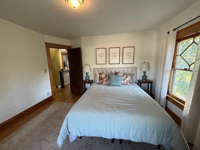 2505 Robinsdale Ave, La Crosse, WI 54601 - bedroom featuring wood finished floors and multiple windows