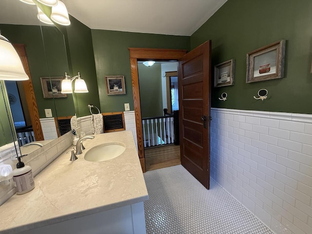 2505 Robinsdale Ave, La Crosse, WI 54601 - bathroom featuring vanity and wainscoting