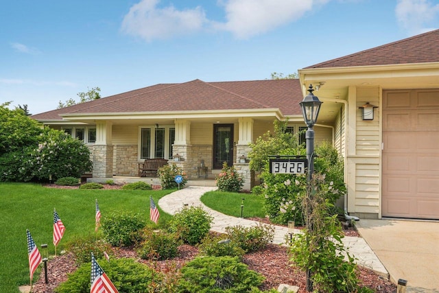 3426 W Links Dr, Franklin, WI 53132 - view of front of home with a front lawn, concrete driveway, a porch, and a garage