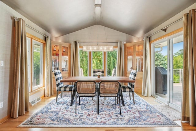 3426 W Links Dr, Franklin, WI 53132 - dining space featuring vaulted ceiling, plenty of natural light, and light wood-style floors
