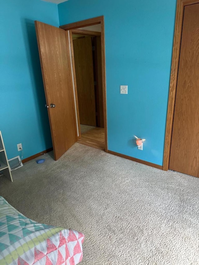W6767 Pine Ave, Medford, WI 54451 - unfurnished bedroom with carpet and a closet