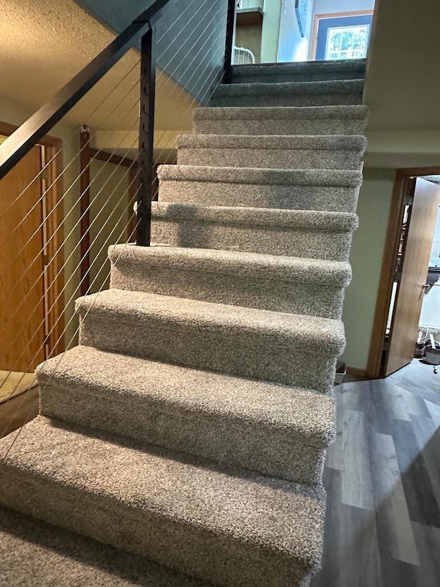 W6767 Pine Ave, Medford, WI 54451 - staircase featuring wood finished floors