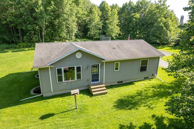 W6767 Pine Ave, Medford, WI 54451 - rear view of property featuring a shingled roof and a lawn