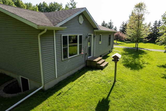 W6767 Pine Ave, Medford, WI 54451 - view of side of property with a lawn and a shingled roof