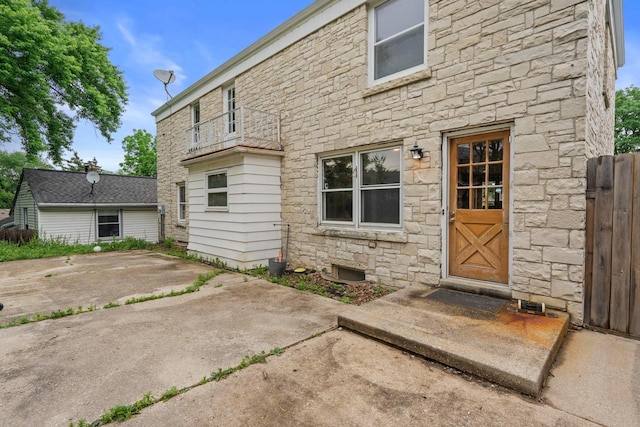 613 Pleasant View St, Wauwatosa, WI 53226 - rear view of house featuring stone siding and a patio