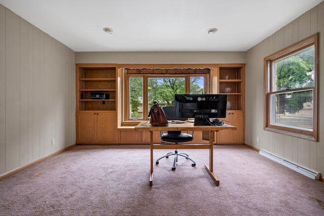 613 Pleasant View St, Wauwatosa, WI 53226 - home office with a baseboard heating unit, wood walls, light colored carpet, and built in shelves