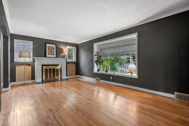 613 Pleasant View St, Wauwatosa, WI 53226 - unfurnished living room with wood-type flooring, crown molding, and a fireplace with flush hearth