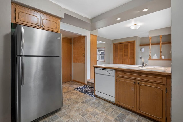 613 Pleasant View St, Wauwatosa, WI 53226 - kitchen with freestanding refrigerator, dishwasher, stone finish flooring, tile counters, and brown cabinets