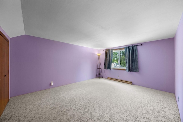 W4976 Pinewood Ln, Merrill, WI 54452 - carpeted empty room with baseboard heating and vaulted ceiling