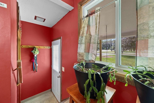 W4976 Pinewood Ln, Merrill, WI 54452 - entryway with a textured ceiling and baseboards