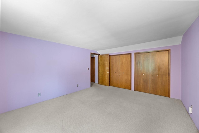 W4976 Pinewood Ln, Merrill, WI 54452 - unfurnished bedroom with multiple closets and carpet flooring