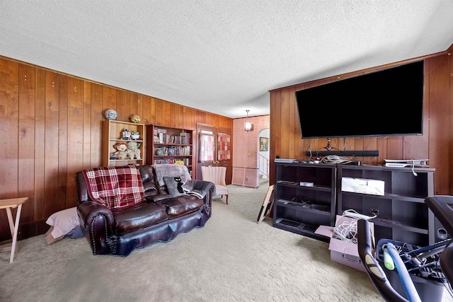 W4976 Pinewood Ln, Merrill, WI 54452 - living room with wood walls, carpet, and a textured ceiling