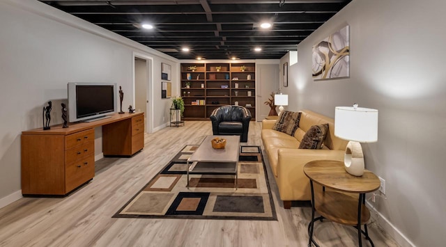N78W15518 Old Gate Rd, Menomonee Falls, WI 53051 - living area with light wood-style flooring, built in shelves, and an office area