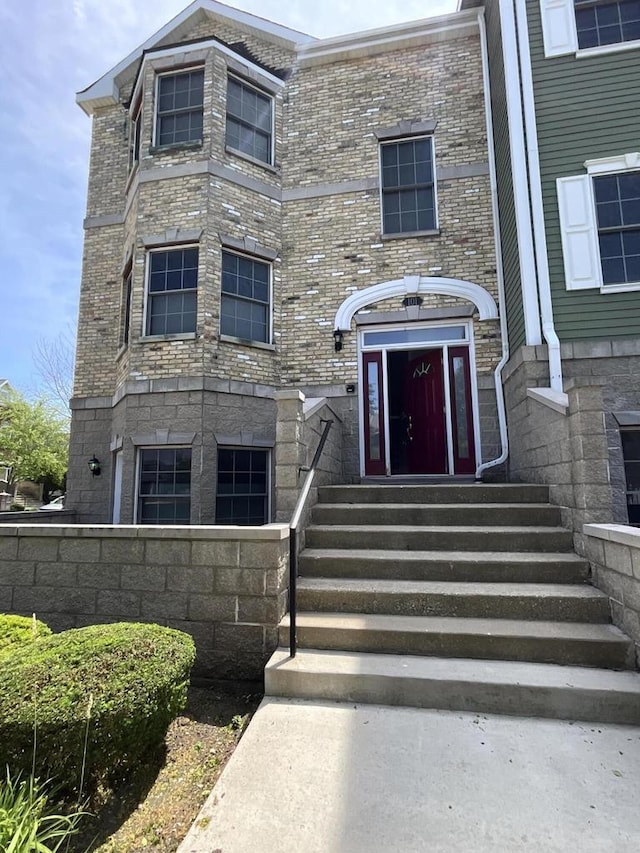 7918 Fredricksburg Ct Unit 101, Bristol, WI 53104 - view of exterior entry featuring stone siding and brick siding