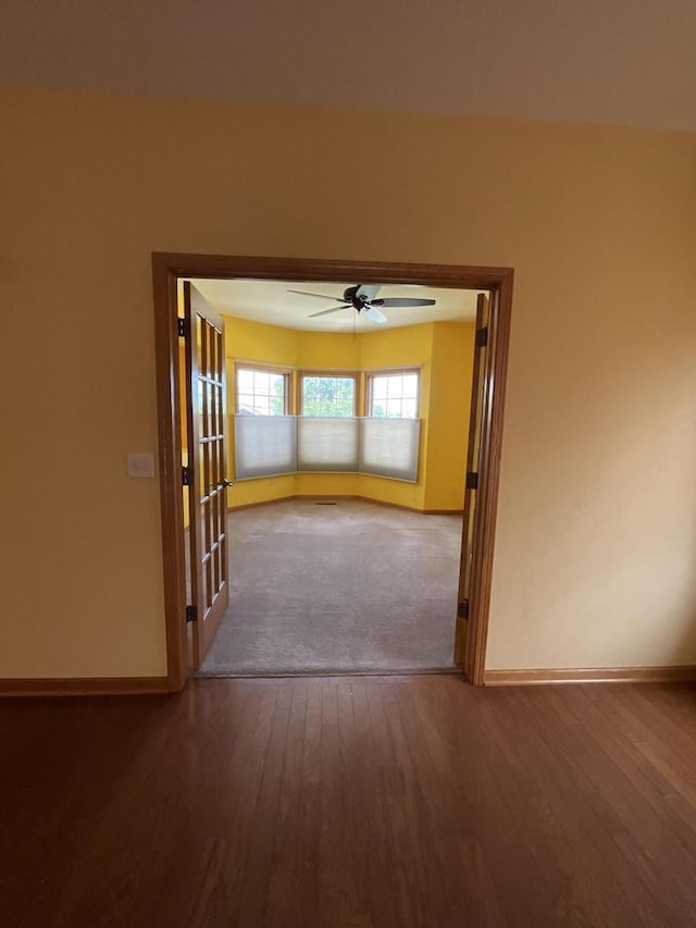 7918 Fredricksburg Ct Unit 101, Bristol, WI 53104 - hallway featuring hardwood / wood-style floors and baseboards