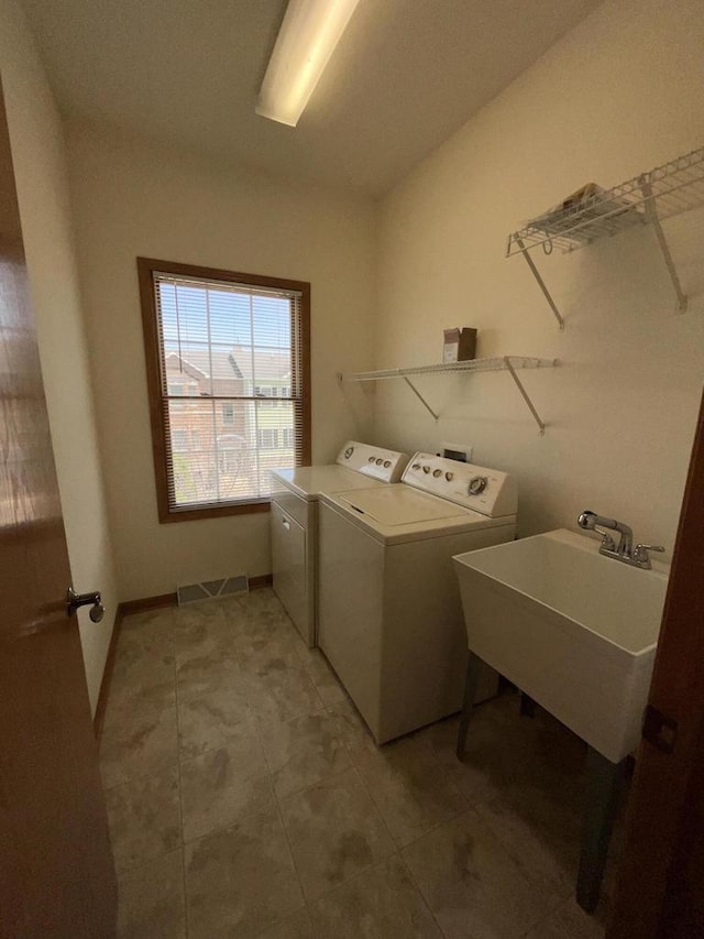 7918 Fredricksburg Ct Unit 101, Bristol, WI 53104 - washroom with independent washer and dryer and light tile patterned floors