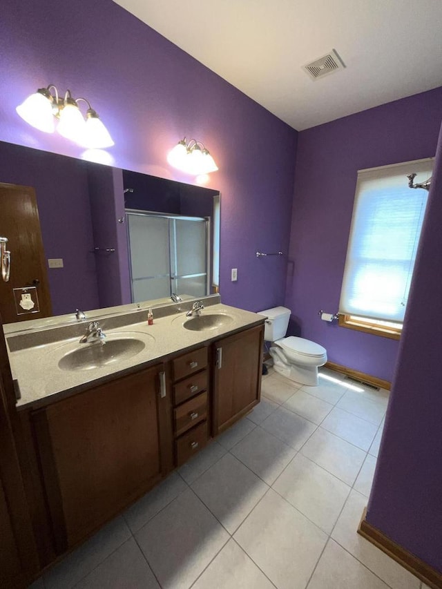 7918 Fredricksburg Ct Unit 101, Bristol, WI 53104 - bathroom featuring tile patterned floors, double vanity, and an enclosed shower