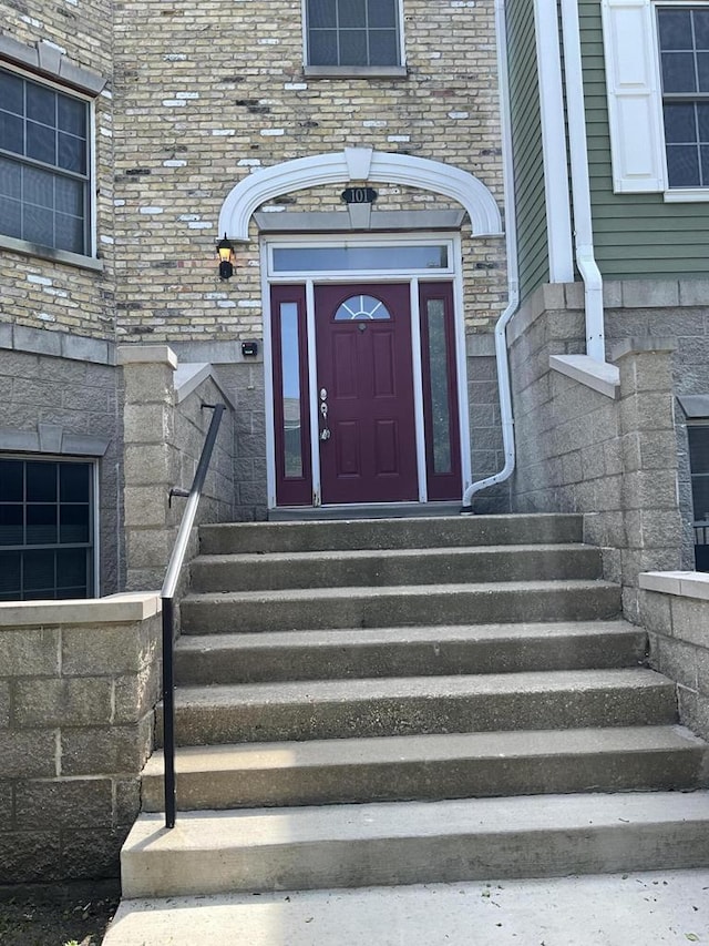 7918 Fredricksburg Ct Unit 101, Bristol, WI 53104 - property entrance featuring brick siding and stone siding