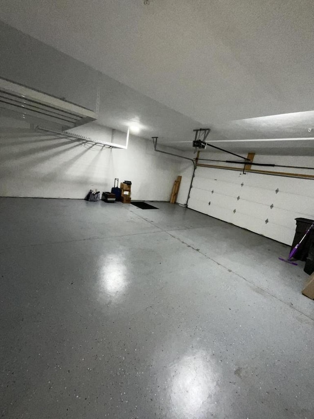 7918 Fredricksburg Ct Unit 101, Bristol, WI 53104 - garage featuring a garage door opener