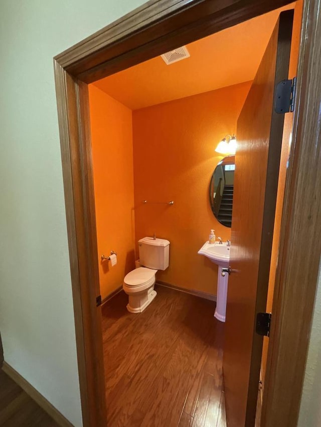 7918 Fredricksburg Ct Unit 101, Bristol, WI 53104 - bathroom with wood finished floors and toilet