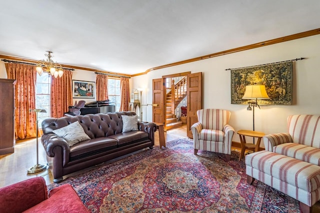 918 Fulton St, Wausau, WI 54403 - living room featuring stairway, wood finished floors, ornamental molding, and a chandelier