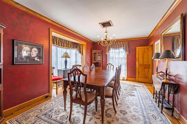 918 Fulton St, Wausau, WI 54403 - dining room featuring a chandelier, ornamental molding, and light wood-style floors