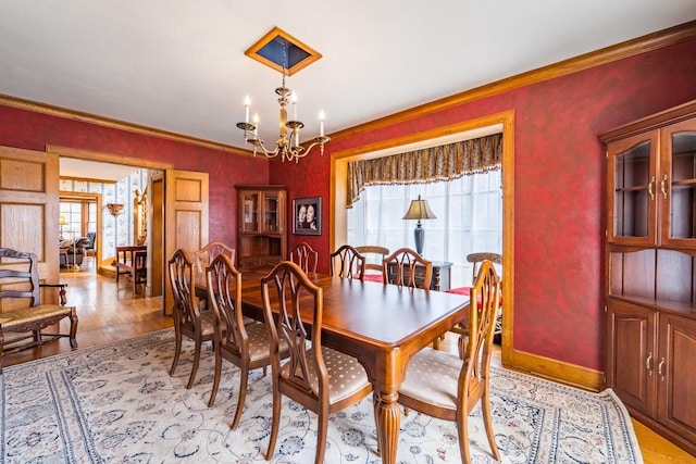 918 Fulton St, Wausau, WI 54403 - dining room featuring light wood finished floors, plenty of natural light, a chandelier, and ornamental molding