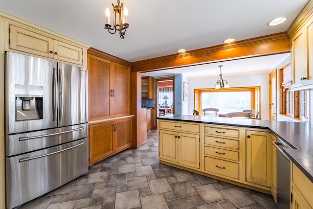 918 Fulton St, Wausau, WI 54403 - kitchen featuring stainless steel appliances, dark countertops, a peninsula, stone finish flooring, and pendant lighting