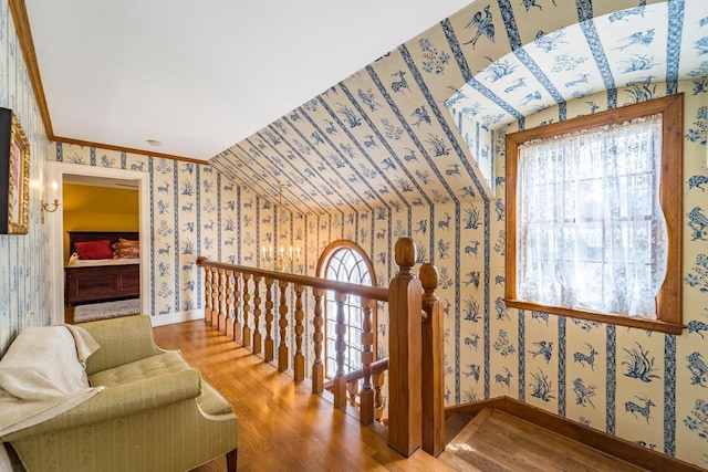 918 Fulton St, Wausau, WI 54403 - stairway with wallpapered walls, wood finished floors, and vaulted ceiling