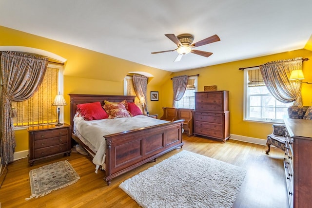 918 Fulton St, Wausau, WI 54403 - bedroom featuring multiple windows, wood finished floors, and ceiling fan
