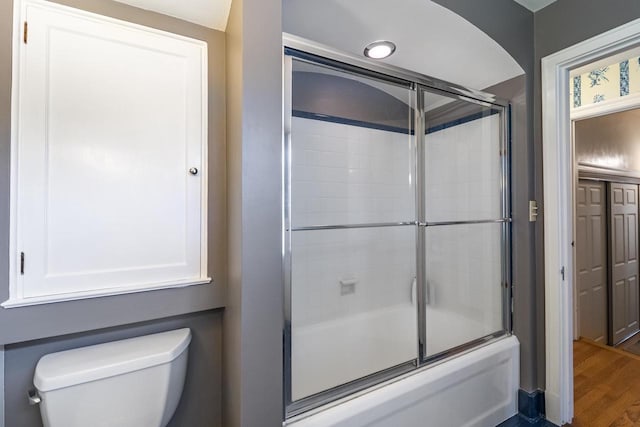 918 Fulton St, Wausau, WI 54403 - bathroom featuring shower / bath combination with glass door and wood finished floors