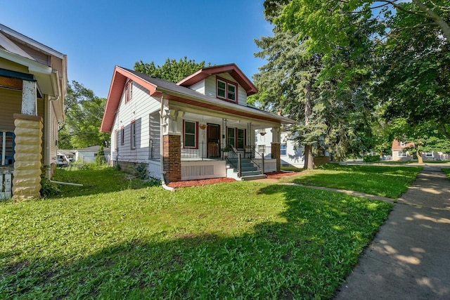 2710 W Fairmount Ave, Milwaukee, WI 53209 - bungalow-style house featuring covered porch and a front yard