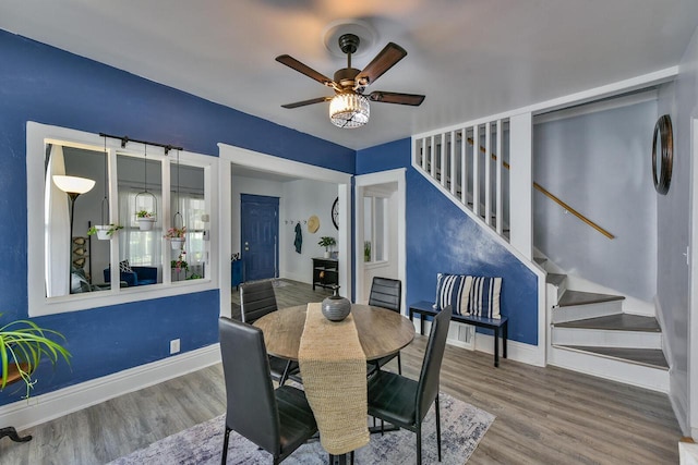 2710 W Fairmount Ave, Milwaukee, WI 53209 - dining space with wood finished floors, ceiling fan, and stairs