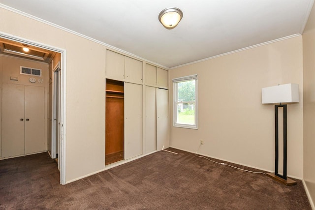 6148 N 38th St, Milwaukee, WI 53209 - unfurnished bedroom featuring ornamental molding, dark colored carpet, and a closet