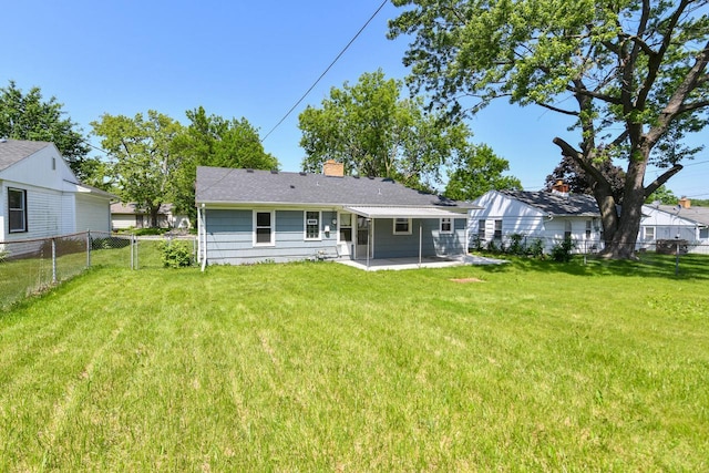 6148 N 38th St, Milwaukee, WI 53209 - back of property with a patio, a fenced backyard, and a chimney