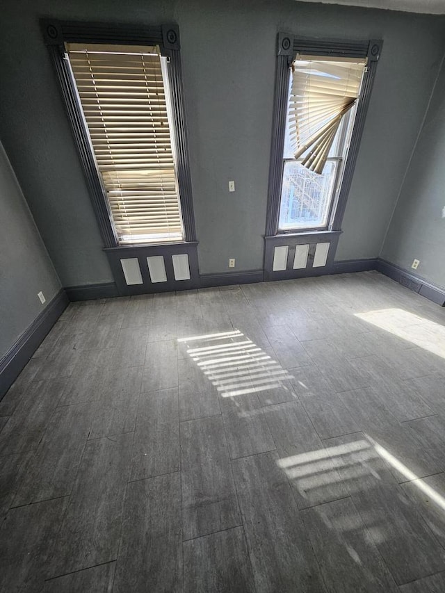 1111 N 12th St, Sheboygan, WI 53081 - spare room with wood finished floors and baseboards