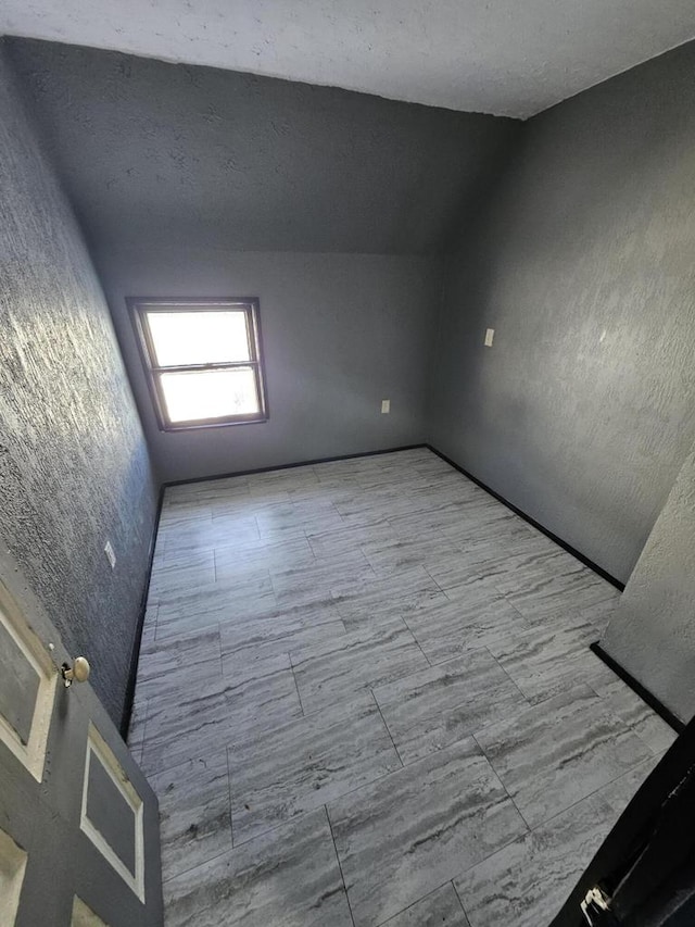 1111 N 12th St, Sheboygan, WI 53081 - unfurnished room with lofted ceiling