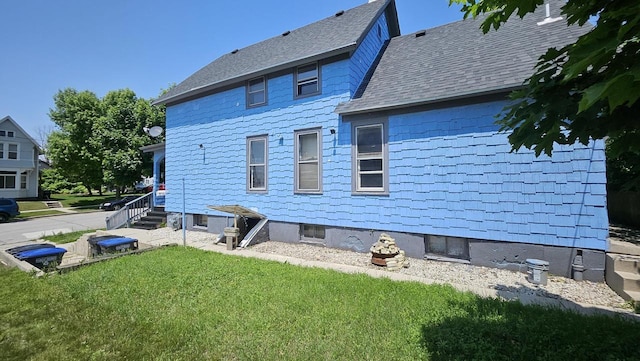 1111 N 12th St, Sheboygan, WI 53081 - back of property with a lawn and roof with shingles