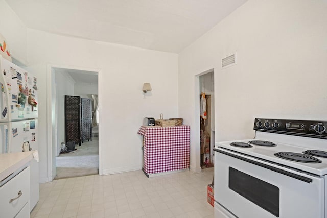 12600 W Prospect Dr, New Berlin, WI 53151 - kitchen featuring white appliances, white cabinets, and light countertops