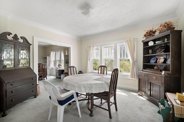 12600 W Prospect Dr, New Berlin, WI 53151 - dining area featuring light carpet, crown molding, and a textured ceiling