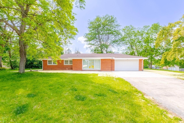 7309 S 46th St, Franklin, WI 53132 - ranch-style home featuring driveway, a garage, a front yard, and brick siding