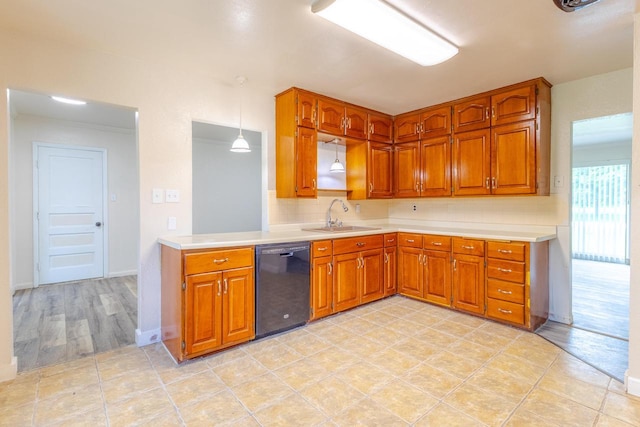 7309 S 46th St, Franklin, WI 53132 - kitchen featuring dishwasher, brown cabinets, light countertops, and light tile patterned floors