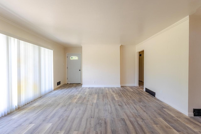 7309 S 46th St, Franklin, WI 53132 - empty room with crown molding and light wood-style flooring
