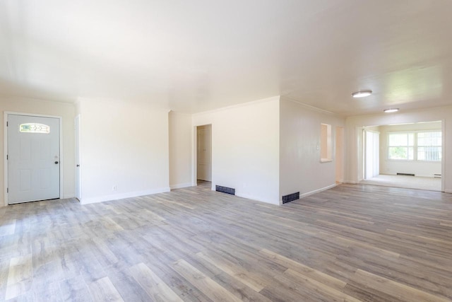 7309 S 46th St, Franklin, WI 53132 - unfurnished living room featuring wood finished floors and ornamental molding