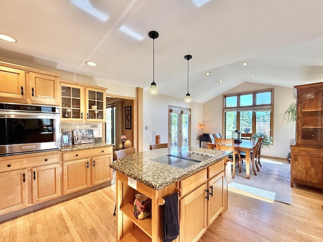 7975 Summit Dr, Delavan, WI 53115 - kitchen featuring stainless steel oven, black electric stovetop, open shelves, light wood-style floors, and vaulted ceiling
