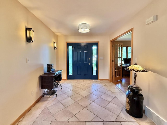 7975 Summit Dr, Delavan, WI 53115 - foyer entrance featuring light tile patterned floors and baseboards
